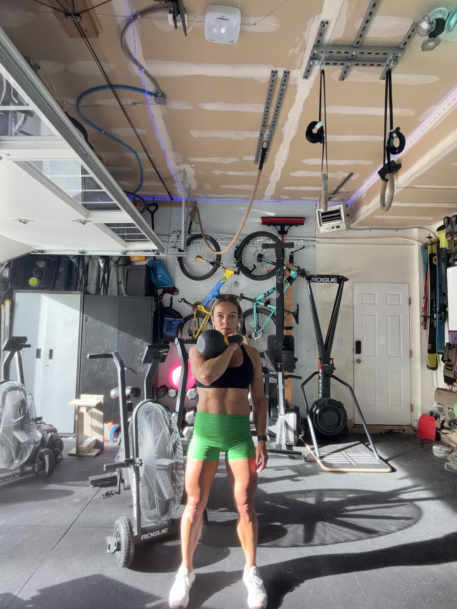 Standing single-arm kettlebell front rack hold